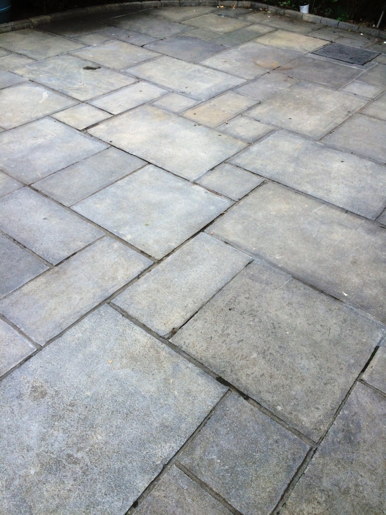 Limestone patio before renovation in Ipswich